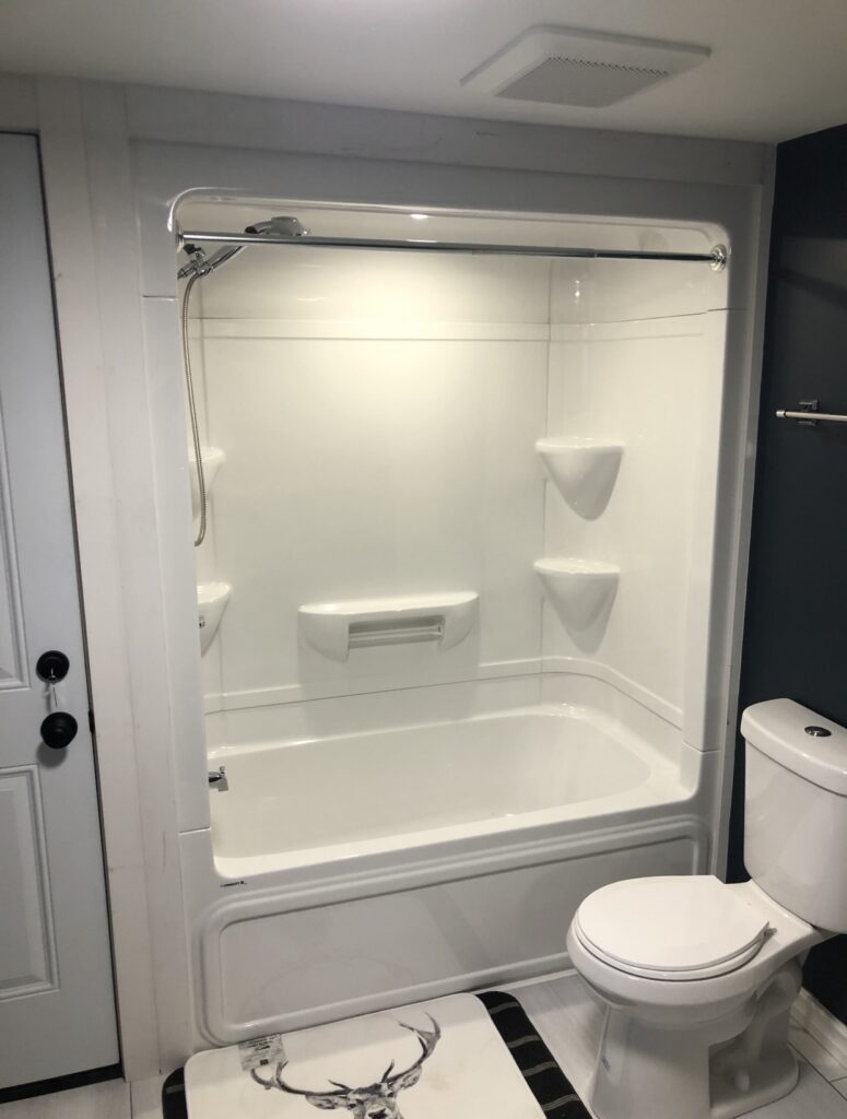 North Bay curbless shower with bench and niche.