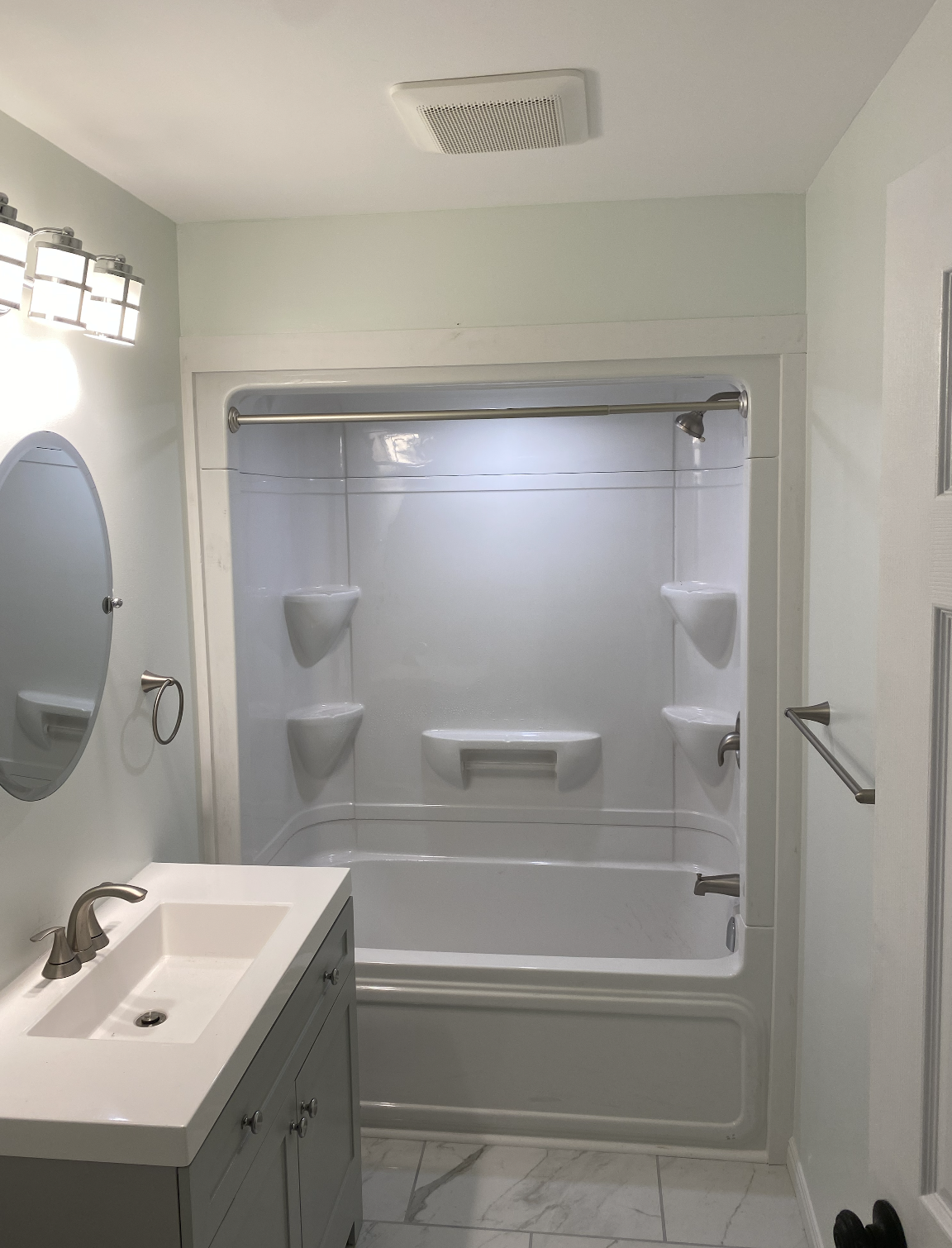 Accessible bathroom renovation in North Bay with walk-in shower and safety features for mobility support