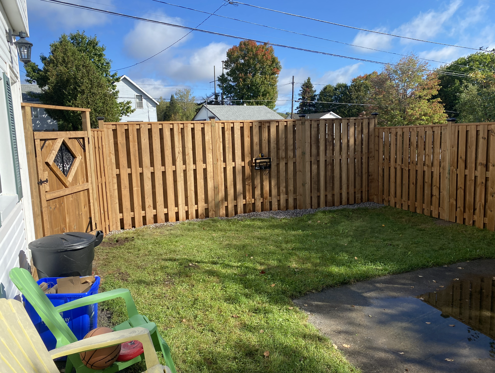 Damaged or leaning fence in North Bay being professionally repaired to fix rot instability and long-term structural issues