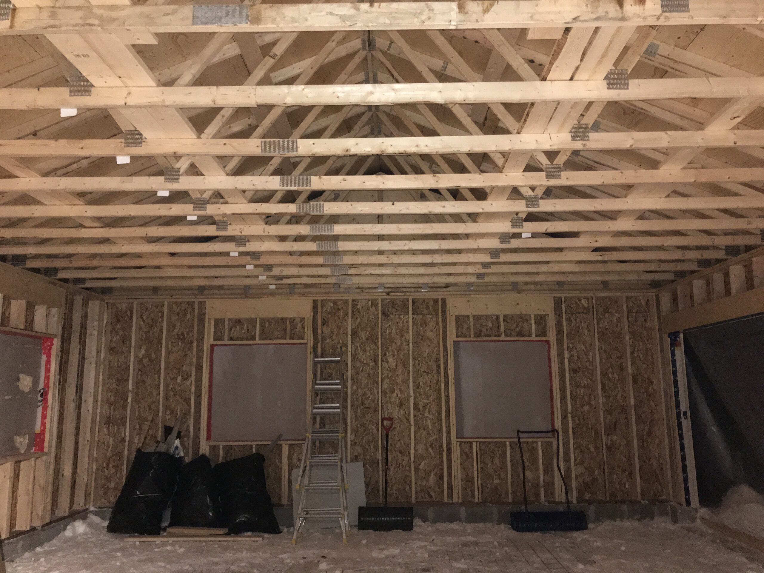 Professional contractor fixing uneven or out-of-square framing in North Bay to ensure proper fit for flooring drywall and trim
