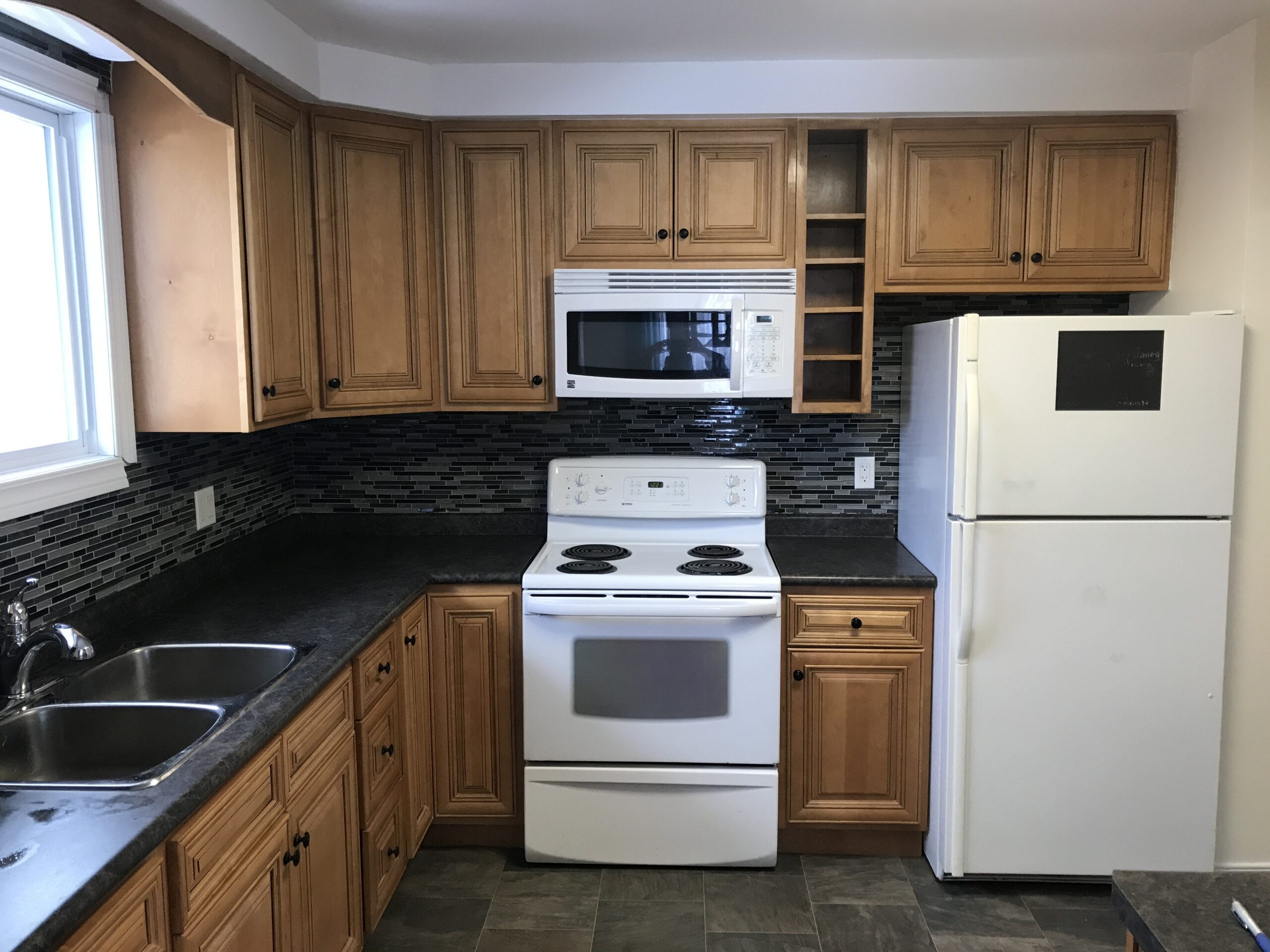Outdated or poorly designed kitchen being renovated in North Bay to fix layout storage and workflow issues